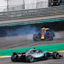 Lewis Hamilton, Mercedes AMG F1 W09, passes a spinning Max Verstappen, Red Bull Racing RB14 Tag Heuer, after the latter suffers a collision with Esteban Ocon, Force India VJM11 Mercedes during the Brazilian GP on November 11, 2018 in Autodromo Jose Carlos Pace, Brazil. (Photo by Andy Hone / LAT Images)