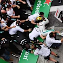 Barriers collapse as Lewis Hamilton, Mercedes AMG F1 celebrates with his mechanics in Parc Ferme during the Brazilian GP on November 11, 2018 in Autodromo Jose Carlos Pace, Brazil. (Photo by Jerry Andre / Sutton Images)