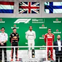 Andrew Shovlin, Chief Race Engineer, Mercedes AMG, Max Verstappen, Red Bull Racing, 2nd position, Lewis Hamilton, Mercedes AMG F1, 1st position, and Kimi Raikkonen, Ferrari, 3rd position, on the podium during the Brazilian GP on November 11, 2018 in Autodromo Jose Carlos Pace, Brazil. (Photo by Glenn Dunbar / LAT Images)