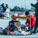 Carlos Sainz does neck exercises between karting sessions. © Oscar Carrascosa/Red Bull Content Pool