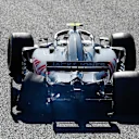 SUZUKA, JAPAN - OCTOBER 07: Kevin Magnussen, Haas F1 Team VF-18, with his rear tyre burst after connecting with Charles Leclerc, Sauber C37 Ferrari during the Japanese GP at Suzuka on October 07, 2018 in Suzuka, Japan. (Photo by Glenn Dunbar / LAT Images)