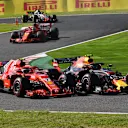 SUZUKA, JAPAN - OCTOBER 07: Kimi Raikkonen, Ferrari SF71H and Max Verstappen, Red Bull Racing RB14 battle during the Japanese GP at Suzuka on October 07, 2018 in Suzuka, Japan. (Photo by Mark Sutton / Sutton Images)