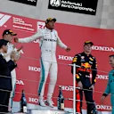 SUZUKA, JAPAN - OCTOBER 07: (L to R): Valtteri Bottas, Mercedes AMG F1, Lewis Hamilton, Mercedes AMG F1 and Max Verstappen, Red Bull Racing celebrate on the podium during the Japanese GP at Suzuka on October 07, 2018 in Suzuka, Japan. (Photo by Manuel Goria / Sutton Images)