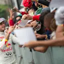 Carlos Sainz signs autographs during Infiniti Red Bull Racing F1 Show Run at the Zocalo Plaza in Mexico City on June 27th, 2015 © Marcos Ferro/Red Bull Content Pool