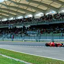 Michael Schumacher(GER) Ferrari F399 leads Hakkinen in front of the impressive Grandstand
Malaysian GP, Sepang, 17 October 1999 © ©Sutton Motorsport Images