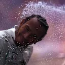 Winner Lewis Hamilton is showered in champagne on the China podium. Image: Mario Renzi