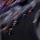 A pack of cars approach the Swimming Pool at speed. (Photo by Mario Renzi)