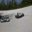Stirling Moss (left) and Lewis Hamilton (right) sample the Mercedes W196 - in streamliner and open-wheel form - on the famous Monza banking © Daimler AG