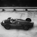 Eugenio Castellotti (Ferrari 555 Supersqualo) tackles the banking in the 1955 race. The following year his left rear tyre threw its tread as he rounded the south banking, spinning him into an infield barrier. He was very lucky to escape injury.  
World Copyright: LAT Photographic.