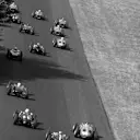 The field head towards the Curve Grande, with the circuit's banked section visible on the right. Italian Grand Prix, Monza, 10 September 1961.
 © Sutton Motorsport Images