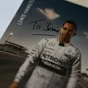 A signed Lewis Hamilton autograph card, dedicated to Formula One group CEO Bernie Ecclestone  © xpbimages.com