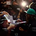 Mercedes' Lewis Hamilton signs autographs for fans © FOWC Ltd