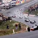 Graham Hill leads the field through Eau Rouge at the start of the 1965 Belgian Grand Prix. © LAT Photographic