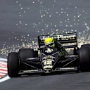 Ayrton Senna (BRA) Lotus 98T, who finished the race in second position, sends the sparks flying as he climbs Eau Rouge. 1986 Belgian Grand Prix. © Sutton Motorsport Images