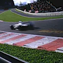 Cars fly through the newly revised Eau Rouge flat out in 2002. Patches are left where the wooden planks scrape the track surface. © LAT Photographic
