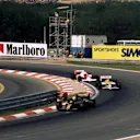 Second place finisher Ayrton Senna (BRA) Lotus 98T leads the eventual winner Nelson Piquet (BRA) Williams FW11 and Alain Prost (FRA) McLaren MP4/2C who had an accident and retired. Hungarian Grand Prix, Hungaroring, 10 August 1986.
 © Sutton Motorsport Images
