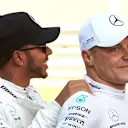 SOCHI AUTODROM, RUSSIAN FEDERATION - SEPTEMBER 29: Lewis Hamilton, Mercedes AMG F1, congratulates Valtteri Bottas, Mercedes AMG F1, on pole during the Russian GP at Sochi Autodrom on September 29, 2018 in Sochi Autodrom, Russian Federation. (Photo by Steve Etherington / LAT Images)