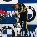 Ayrton Senna (Team Lotus) 1st position, Michele Alboreto (Ferrari) 2nd position and Patrick Tambay (Equipe Renault) 3rd position on the podium. Copyright - LAT Photographic