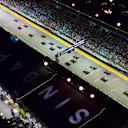 SINGAPORE STREET CIRCUIT, SINGAPORE - SEPTEMBER 16: Lewis Hamilton, Mercedes AMG F1 W09 EQ Power+, Max Verstappen, Red Bull Racing RB14, and Sebastian Vettel, Ferrari SF71H, lead the field away at the start of the race during the Singapore GP at Singapore Street Circuit on September 16, 2018 in Singapore Street Circuit, Singapore. (Photo by Joe Portlock / LAT Images)