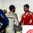 SINGAPORE STREET CIRCUIT, SINGAPORE - SEPTEMBER 16: Sebastian Vettel, Ferrari, 3rd position, congratulates Lewis Hamilton, Mercedes AMG F1, 1st position, in Parc Ferme during the Singapore GP at Singapore Street Circuit on September 16, 2018 in Singapore Street Circuit, Singapore. (Photo by Andy Hone / LAT Images)