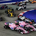 SINGAPORE STREET CIRCUIT, SINGAPORE - SEPTEMBER 16: Esteban Ocon, Racing Point Force India VJM11, Sergio Perez, Racing Point Force India VJM11 and Romain Grosjean, Haas F1 Team VF-18 during the Singapore GP at Singapore Street Circuit on September 16, 2018 in Singapore Street Circuit, Singapore. (Photo by Manuel Goria / Sutton Images)