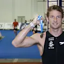 Jenson Button proudly displays his medal after completing the 2010 London Triathlon in aid of Make-A-Wish Foundation UK. © Sutton Motorsport Images