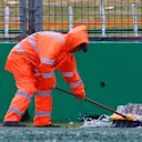 Marshal sweeps water from the track.
Formula One World Championship, Rd1, Australian Grand Prix, Qualifying, Albert Park, Melbourne, Australia, Saturday 16 March 2013. © Sutton Motorsport Images