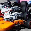 CIRCUIT OF THE AMERICAS, UNITED STATES OF AMERICA - OCTOBER 21: Romain Grosjean, Haas F1 Team VF-18, leads Charles Leclerc, Sauber C37 Ferrari, and Fernando Alonso, McLaren MCL33, at the start during the United States GP at Circuit of the Americas on October 21, 2018 in Circuit of the Americas, United States of America. (Photo by Glenn Dunbar / LAT Images)
