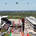 CIRCUIT OF THE AMERICAS, UNITED STATES OF AMERICA - OCTOBER 21: Three Boeing AH-64E Apache gunship helicopters with a pair of Boeing CH-47F Chinook transports from the Dutch Air Force 302 Training Squadron (Fort Hood) fly over the grid during the United States GP at Circuit of the Americas on October 21, 2018 in Circuit of the Americas, United States of America. (Photo by Joe Portlock / LAT Images