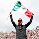 AUTODROMO HERMANOS RODRIGUEZ, MEXICO - OCTOBER 28: Fernando Alonso, McLaren, celebrates with a Mexican flag ahead of the race during the Mexican GP at Autodromo Hermanos Rodriguez on October 28, 2018 in Autodromo Hermanos Rodriguez, Mexico. (Photo by Steven Tee / LAT Images)