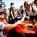 Fernando Alonso (ESP) Ferrari at the drivers autograph session. Formula One World Championship, Rd19, Abu Dhabi Grand Prix, Preparations, Yas Marina Circuit, Abu Dhabi, UAE, Thursday, 20 November 2014 