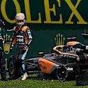 McLaren's Australian driver Daniel Ricciardo gets out of his car after crashing with Haas F1 Team's Danish driver Kevin Magnussen during the Formula One Brazil Grand Prix at the Autodromo Jose Carlos Pace racetrack, also known as Interlagos, in Sao Paulo, Brazil, on November 13, 2022. (Photo by MAURO PIMENTEL / AFP) (Photo by MAURO PIMENTEL/AFP via Getty Images)