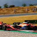 Lando Norris, McLaren MCL35, battles with Charles Leclerc, Ferrari SF1000