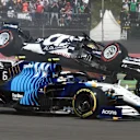 AlphaTauri's Japanese driver Yuki Tsunoda (Top) crashes during the Formula One Mexico Grand Prix at the Hermanos Rodriguez racetrack in Mexico City on November 7, 2021. (Photo by ALFREDO ESTRELLA / AFP) (Photo by ALFREDO ESTRELLA/AFP via Getty Images)