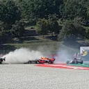 Haas driver Romain Grosjean of France, left, and Red Bull driver Max Verstappen of the Netherlands go of the track during the Formula One Grand Prix of Tuscany, at the Mugello circuit in Scarperia, Italy, Sunday, Sept. 13, 2020. (AP Photo/Luca Bruno, Pool)