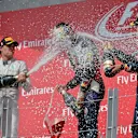 (L to R): Nico Rosberg (GER) Mercedes AMG F1, Daniel Ricciardo (AUS) Red Bull Racing and Sebastian Vettel (GER) Red Bull Racing celebrate on the podium with the champagne.
Formula One World Championship, Rd7, Canadian Grand Prix, Race Day, Montreal, Canada, Sunday 8 June 2014.
