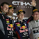 (L to R): Gavin Ward (GBR) Red Bull Racing Performance Engineer, Mark Webber (AUS) Red Bull Racing, race winner Sebastian Vettel (GER) Red Bull Racing and Nico Rosberg (GER) Mercedes AMG F1 celebrate on the podium. Formula One World Championship, Rd17, Abu Dhabi 