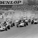 Pole position man Mario Andretti (USA) Lotus 49B gets away ahead of Graham Hill(GBR) Lotus 49B and eventual winner Jackie Stewart(GBR) Matra MS10 US GP, Watkins Glen, 6 October 1968 © Sutton Images. No reproduction without permission