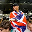 Lewis Hamilton (GBR) Mercedes AMG F1 celebrates with the team. Formula One World Championship, Rd19, Abu Dhabi Grand Prix, Race, Yas Marina Circuit, Abu Dhabi, UAE, Sunday, 23 November 2014 