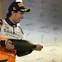 Sergio Perez (MEX) Force India celebrates on the podium. Formula One World Championship, Rd3, Bahrain Grand Prix, Race, Bahrain International Circuit, Sakhir, Bahrain, Sunday, 6 April 2014