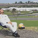 McLaren's Fernando Alonso soaks up the Sao Paulo sun after dropping out of qualifying in Brazil © FOWC Ltd