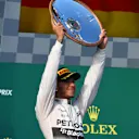 Race winner Lewis Hamilton (GBR) Mercedes AMG F1 celebrates with the trophy on the podium at Formula One World Championship, Rd1, Australian Grand Prix, Race, Albert Park, Melbourne, Australia, Sunday 15 March 2015. © Sutton Motorsport Images