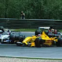 Nick Heidfeld's out-of-control Sauber can be spotted to the left of this picture as he lurches towards Takuma Sato's hapless Jordan. Austrian Grand Prix A1 Ring Austria. 12 May 2002. © Sutton Motorsport Images 