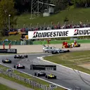 The field head past the crash of Takuma Sato (JPN) Jordan Honda EJ12.
Austrian Grand Prix, A1-Ring, 12 May 2002. © Sutton Motorsport Images