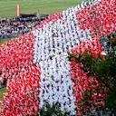 Fans with flags in the grandstand to make the Austrian National flag.
Formula One World Championship, Rd8, Austrian Grand Prix, Race, Spielberg, Austria, Sunday 22 June 2014 © Sutton Motorsport Images