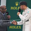 Edwin Moses (USA), legendary 400 metre hurdler, talks to Lewis Hamilton (GBR) Mercedes AMG F1 on the podium at Formula One World Championship, Rd3, Chinese Grand Prix, Race, Shanghai, China, Sunday 12 April 2015. © Sutton Motorsport Images