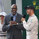 Edwin Moses (USA), legendary 400 metre hurdler, talks to Lewis Hamilton (GBR) Mercedes AMG F1 on the podium at Formula One World Championship, Rd3, Chinese Grand Prix, Race, Shanghai, China, Sunday 12 April 2015. © Sutton Motorsport Images