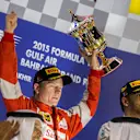 Kimi Raikkonen (FIN) Ferrari with the trophy on the podium at Formula One World Championship, Rd4, Bahrain Grand Prix Race, Bahrain International Circuit, Sakhir, Bahrain, Sunday 19  April 2015. © Sutton Motorsport Images