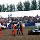 Michael Schumacher (Benetton B195 Renault) trudges away after colliding with Damon Hill (Williams FW17 Renault) on lap 46 at Silverstone. World Copyright: LAT Photographic