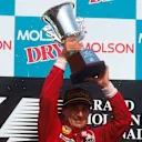 Jean Alesi (Ferrari) 1st position, celebrates his maiden Grand Prix win on the podium. 1995 Canadian Grand Prix. Montreal, Quebec, Canada. 9-11 June 1995.  © LAT Photographic